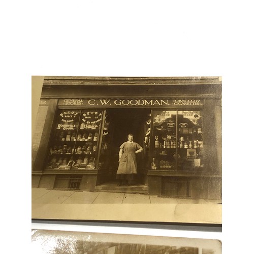 582 - 2 early 1900s shop front real photo postcards