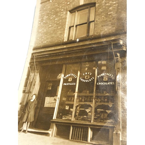 582 - 2 early 1900s shop front real photo postcards