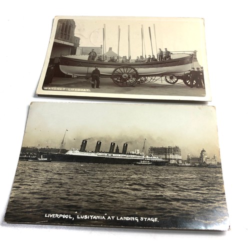 572 - 2 antique real photo postcards R.M.S Lusitania at liverpool landing stage & watchet lifeboat & crew