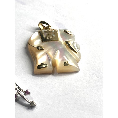 48 - 9ct gold pendants includes pink sapphire & diamond pearl & diamond mother of pearl elephant