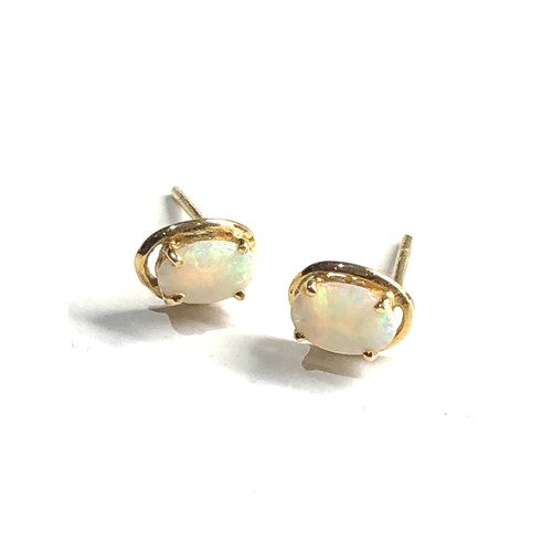 97 - 18ct gold opal earrings weight 0.8