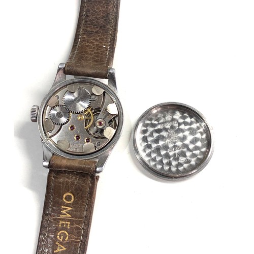 506 - Vintage Gents military style Omega wristwatch omega strap and buckle watch is ticking but no warrant... 