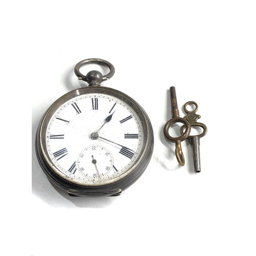 517 - Silver open face pocket watch the watch is ticking but no warranty is given