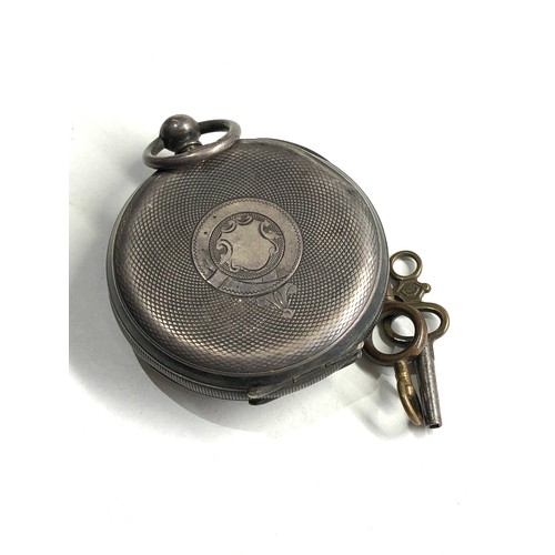 517 - Silver open face pocket watch the watch is ticking but no warranty is given