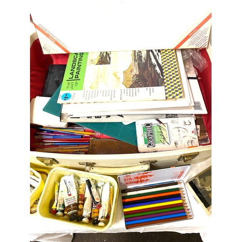 247 - Vintage suitcase full of artist equipment to include sketch books, canvas etc