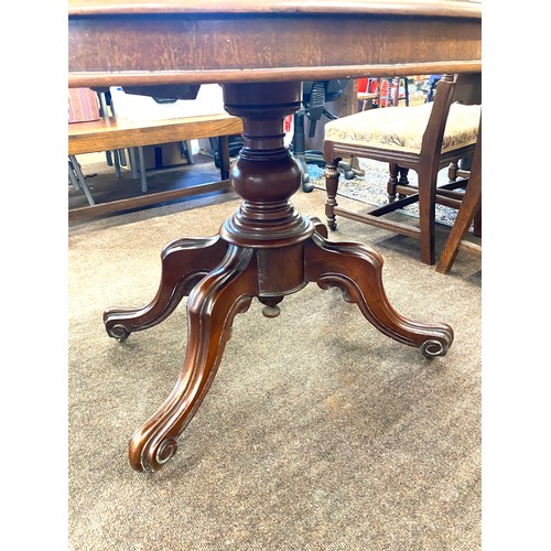 384 - Victorian mahogany loo table with original casters