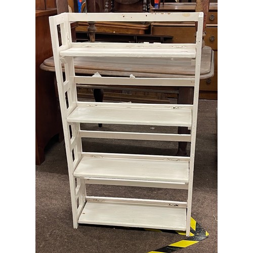 369 - White folding bookcase measures approx height 40 inches width 24th inches depth 9 inches