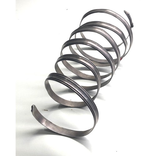 357 - Large silver arm coiled snake bangle measures approx 21cm long xrt tested as silver