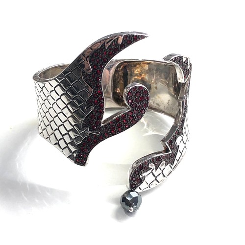 348 - Garnet set silver bangle weight 83g