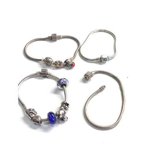 366 - 4 silver Carmilla charm bracelets