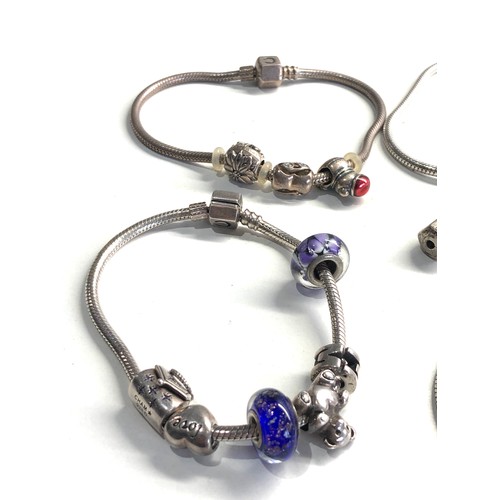 366 - 4 silver Carmilla charm bracelets