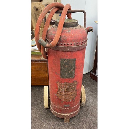 100D - Vintage fire extinguisher on wheels, approximate height: 38 inches, width 15 inches