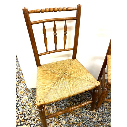494 - 2 Antique oak and straw chairs