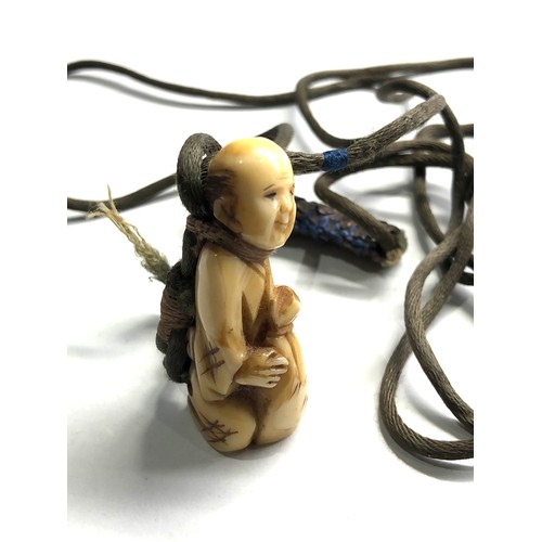 488 - Antique ivory netsuke on original cord