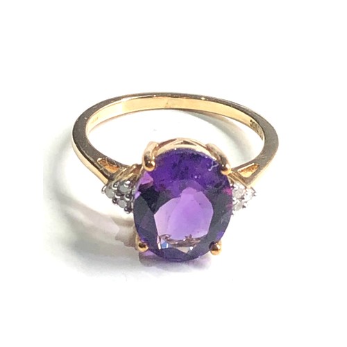 318 - 9ct gold amethyst & diamond ring weight 2.9g