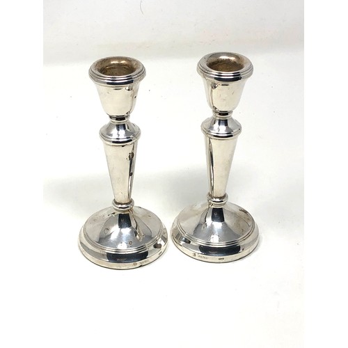 84 - Pair of silver candlesticks Birmingham silver hallmarks measure height 14.5cm filled bases