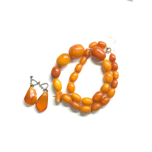 334 - Egg yolk amber bead necklace & earrings chips to amber total weight 47g