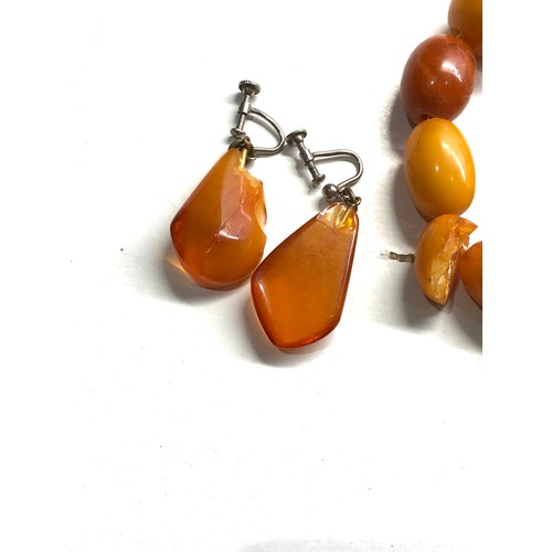 334 - Egg yolk amber bead necklace & earrings chips to amber total weight 47g