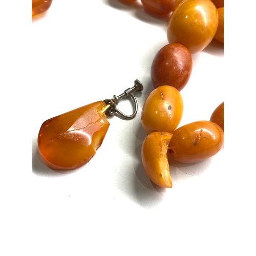 334 - Egg yolk amber bead necklace & earrings chips to amber total weight 47g