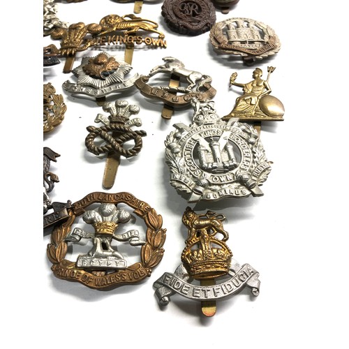 409 - 20 military cap badges