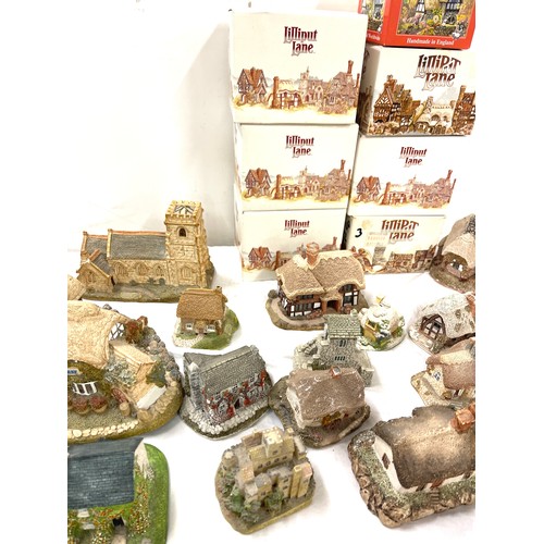 305 - Large selection of Lilliput lane and Milestone ornamental cottages