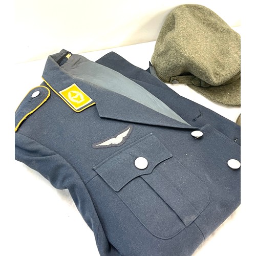 280 - Selection of military uniform to include 2 jackets, 1 cap, 1 hard hat, drinking bottle