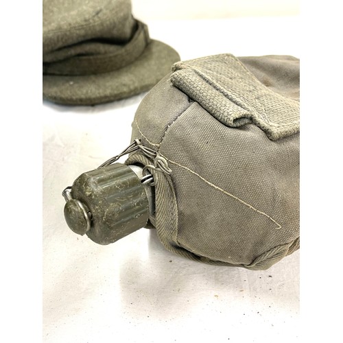 280 - Selection of military uniform to include 2 jackets, 1 cap, 1 hard hat, drinking bottle