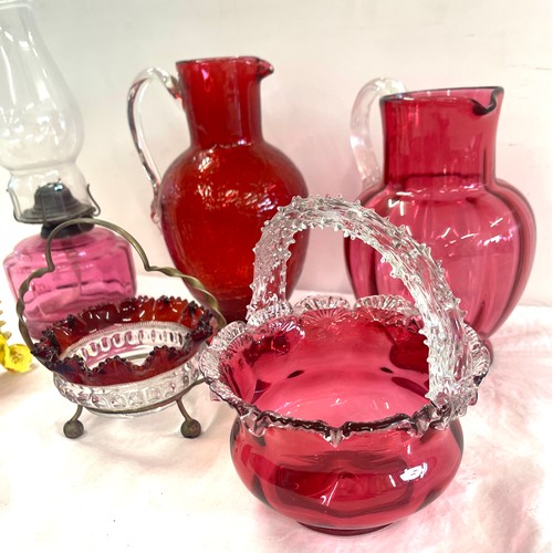 273 - Selection of antique and later Cranberry glass to include an oil lamp, jugs etc