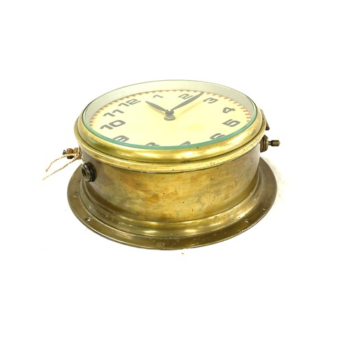 21 - Antique brass ships clock, wind up with key, untested, diameter approximately 10.5 inches