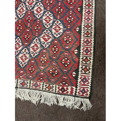 142 - Vintage rug measures approx 72