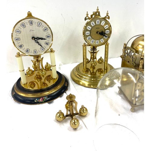 185 - 3 Vintage dome clocks without matching domes, 3 glass domes a mantel clock and spare working