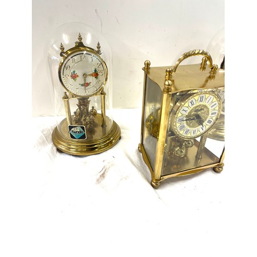 177 - 3 Vintage dome clocks with glass domes and 1 other carriage clock