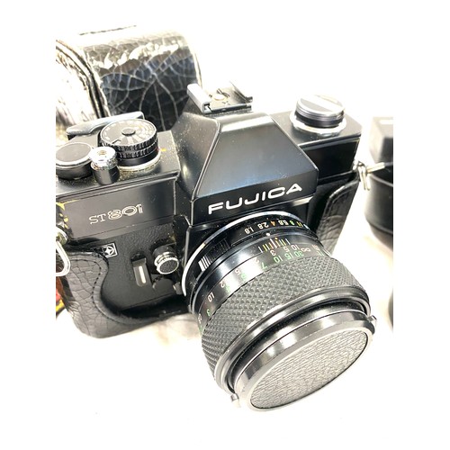 266 - Fujica st80i camera in case with Fujica 135mm photo film lense with case and a Fujica 28mm lense