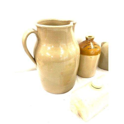 250 - Large selection of earthen ware jug measures 15