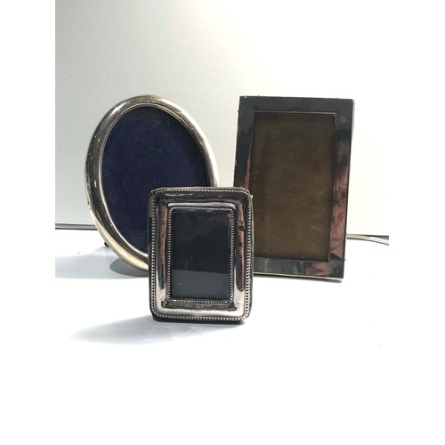 490 - 3 silver hallmarked picture frames largest measures approx 15cm by 11cm