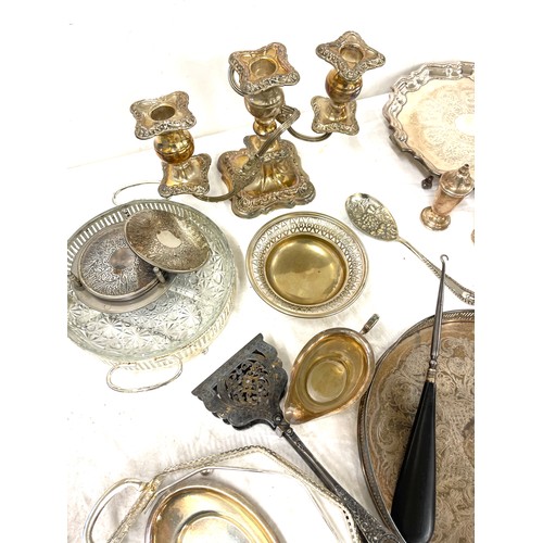 202 - Selection of silver plated items includes candle sticks,