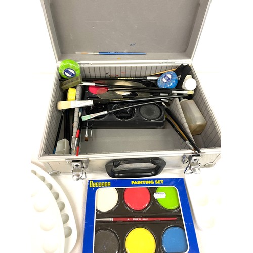 122 - Cased selection of artists equipment, includes paints, paint trays, brushes etc