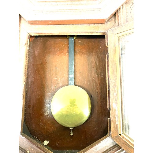 84 - 2 Keyhole wall clock with pendulum, untested