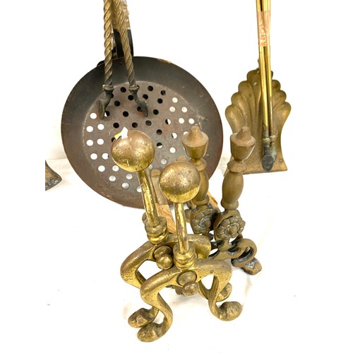 104B - Large selection of brass companion sets and fire dogs