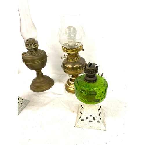 134 - 4 Vintage oil lamps, one has been converted into electric