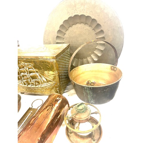 243 - Selection of brass and copper ware includes brass pan, charger etc