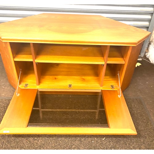 389 - Teak corner tv cabinet with glass front measures approx 21.5