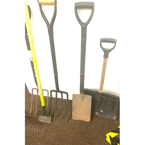 348 - Selection of garden tools to include hose, rakes, spade etc