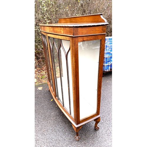 368 - Oak glass display cabinet with ball and claw feet measures approx 52