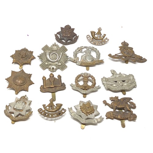 413 - Selection of military cap badges