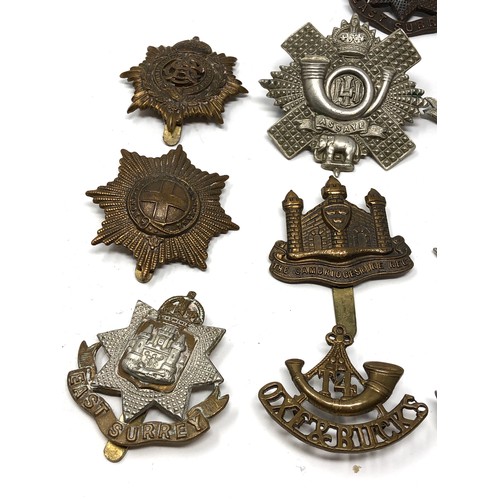 413 - Selection of military cap badges