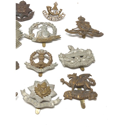 413 - Selection of military cap badges