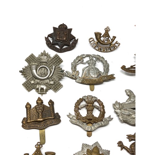 413 - Selection of military cap badges