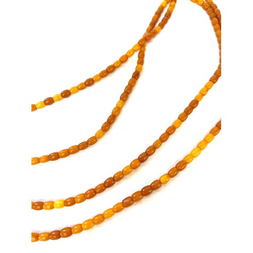 555 - Vintage long amber bead necklace, approximate weight of necklace 60.6g, length 177cm