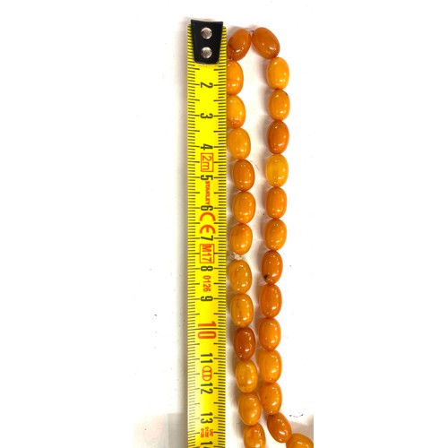 556 - Vintage long amber bead necklace, approximate weight of necklace 89g, approximate length 250cm